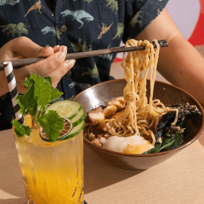 customer eating char siu pork noodles