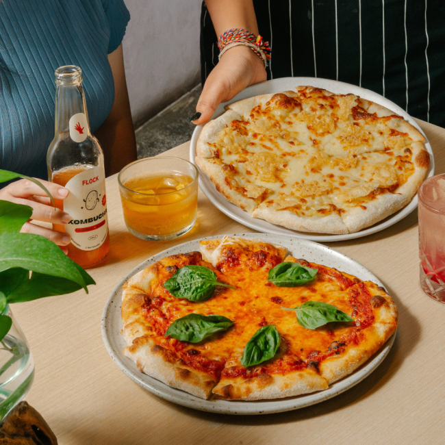 2 pizza in ubud bali with 1 bottle of kombucha balui